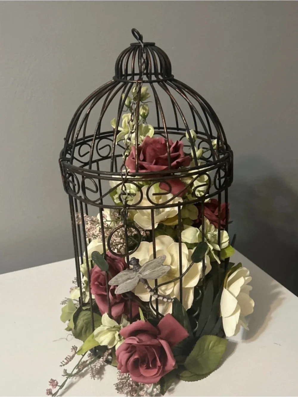 Black Metal Birdcage Floral Centerpiece with Burgundy and Cream Roses